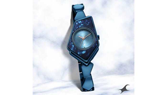 A fashionably different, futuristic statement watch with a triangular-shaped blue face and a stylishly patterned strap that is sure to draw attention.