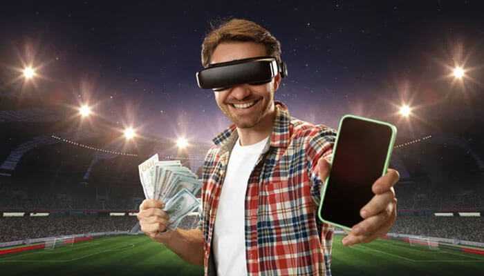 A man in a vr headset holding cash and phone in a stadium, symbolizing technology and the creation of sports betting platforms.