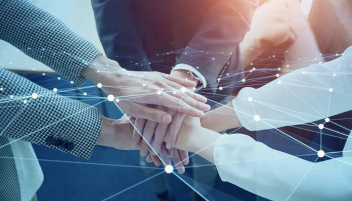 Hands put together for teamwork and collaboration, and the nodes connected are all about professional growth.