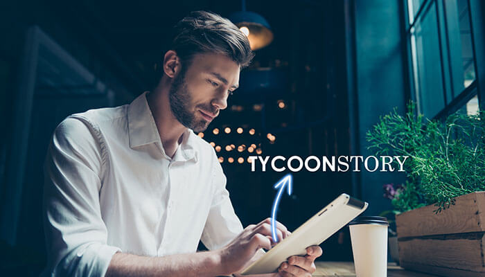 A man using a tablet in a modern workspace, with the 'TYCOONSTORY' logo, highlighting new learning experiences.