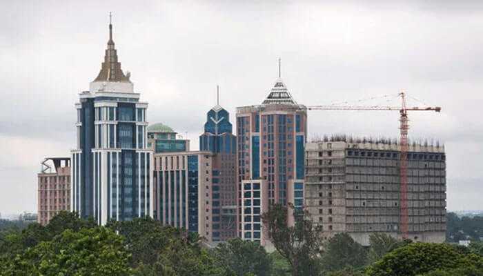 The skyline of new apartments in bangalore with ongoing construction and commercial towers, reflecting rapid real estate growth and development.