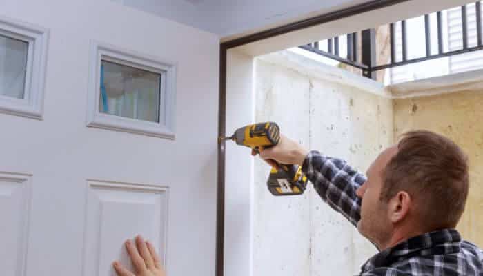 How to fix squeaky door by tightening loose hinge screws with a cordless drill to eliminate hinge movement, reduce friction, and restore smooth door operation.