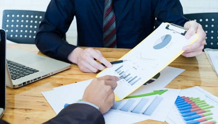 Litigation support services experts reviewing legal documents, financial charts, and case data to improve dispute analysis and strategy.