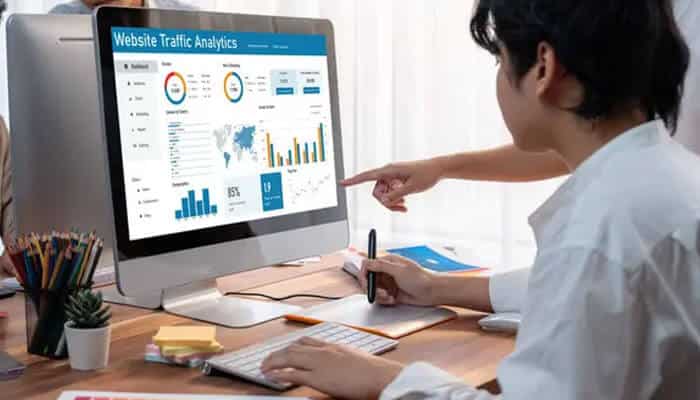 How much should you spend on display advertising - tycoonstory | tycoonstory media Display advertising agency specialist analyzing website traffic, audience performance, campaign conversions, and digital advertising metrics on an analytics dashboard.