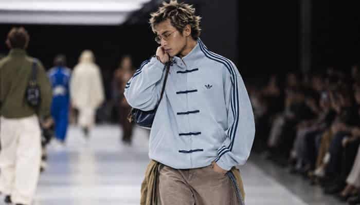 Adidas chinese new year jacket 2026 displayed in a runway-inspired fashion setting with adidas originals styling, traditional knot closures, loose fit design, and contemporary streetwear trends.
